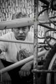 Tricycle Young Boy - Piercing Religious Signs Portrait